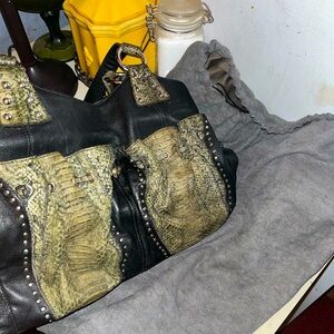 CHI by Falchi Black Lambskin leather and snakeskin.